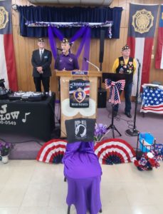 San Antonio Purple Heart Recipient speaking with two others behind him