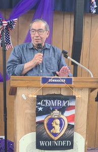 man speaking at podium for San Antonio Purple Heart Recipients Celebration