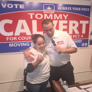 Tommy Calvert hugging woman