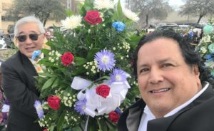Ramon Chapa jr next to a wreath