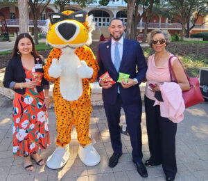 Cheetos mascot taking a group photo